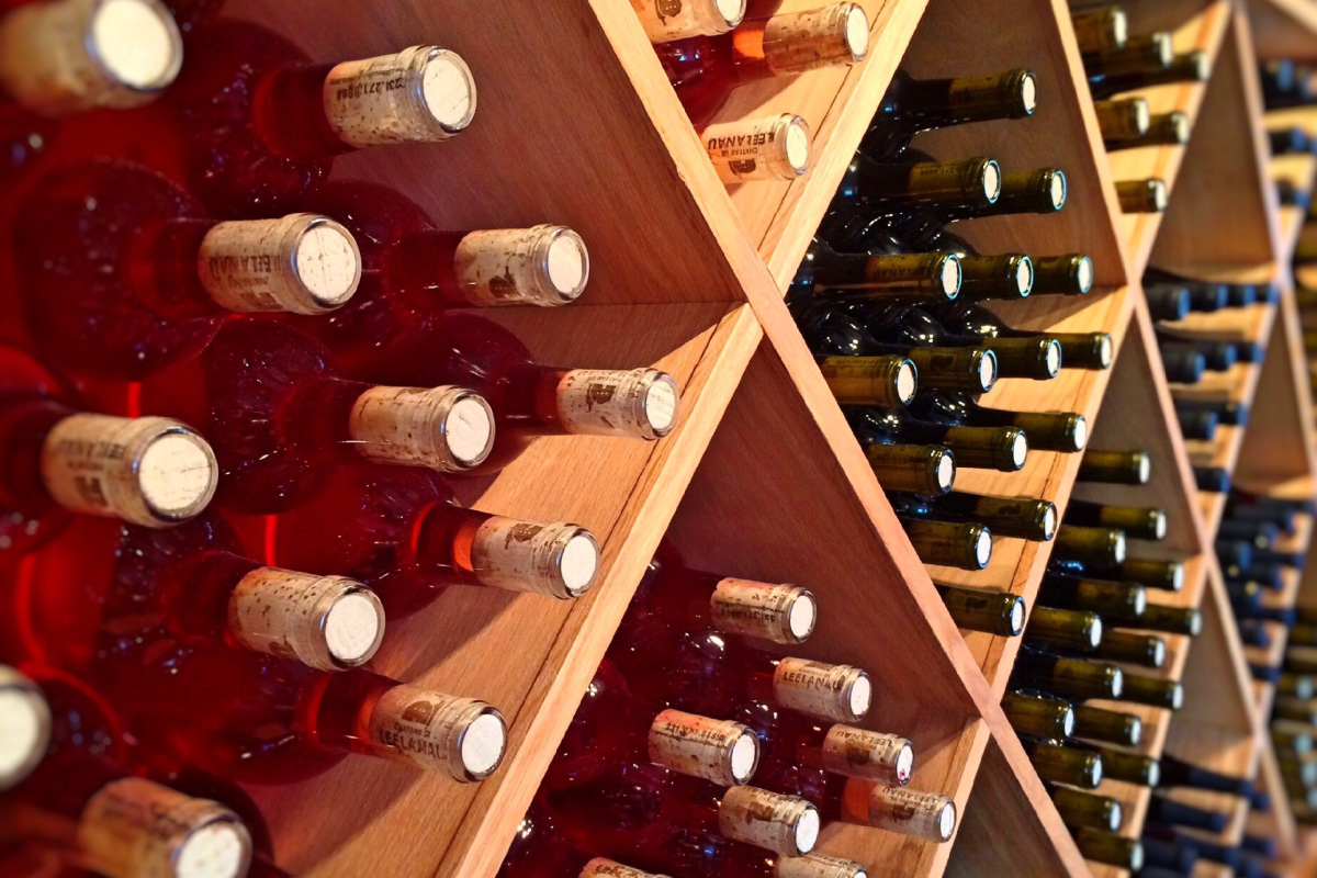 a display case filled with lots of bottles of wine